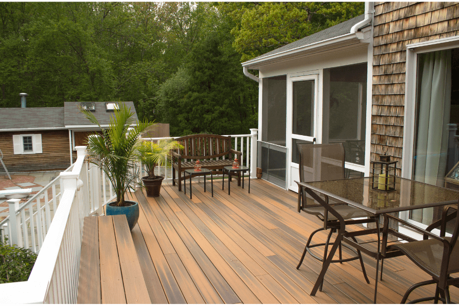 Garden decking flooring with white composite fencing on patio area of Swansea property- Elite Carpenters Swansea