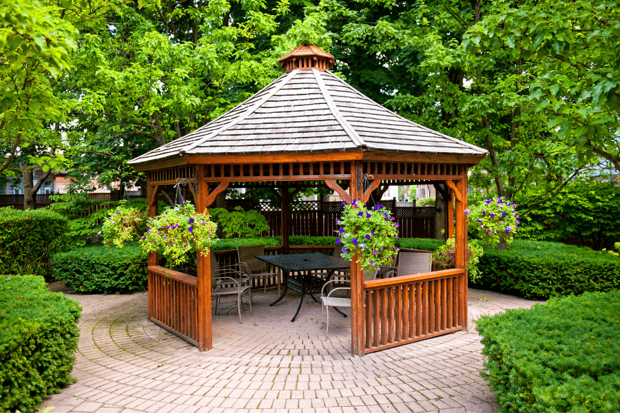 Gazebo with tiled pitch roof built by Elite Carpenters Swansea in park area on outskirts of city